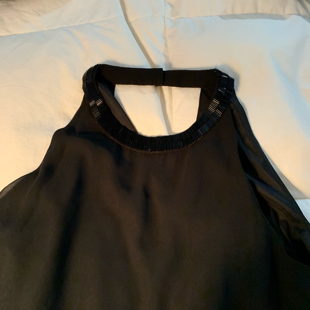 Sleeveless black beaded silk shirt